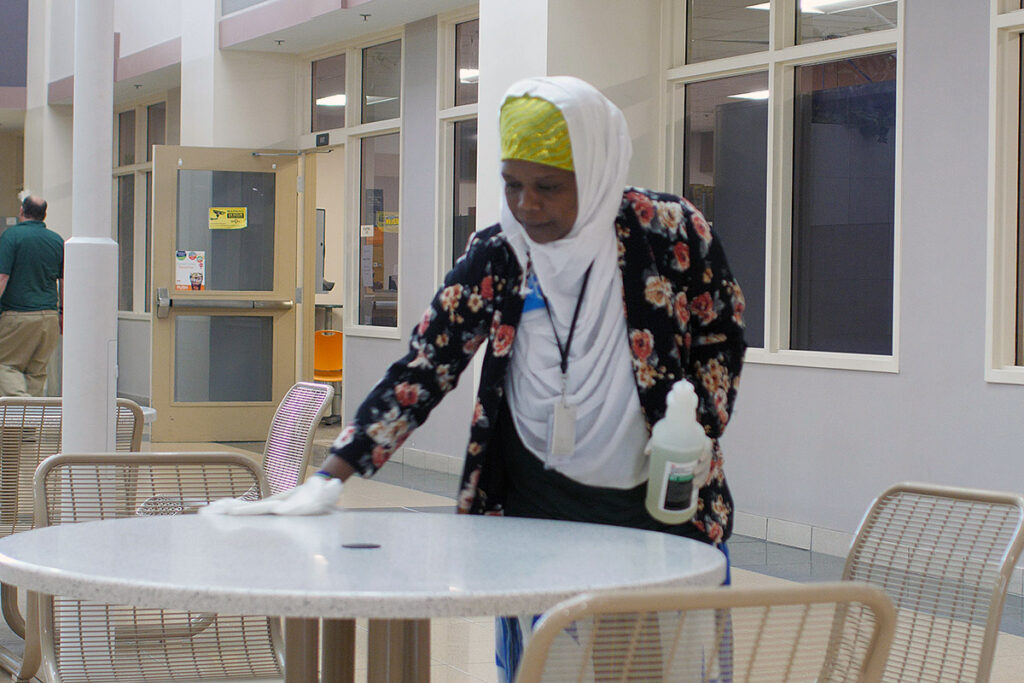Woman cleaning a table